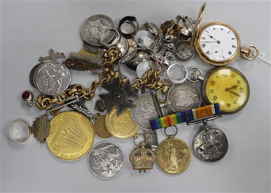 Mixed coins, medals, brooches and a boxed watch opening tool.